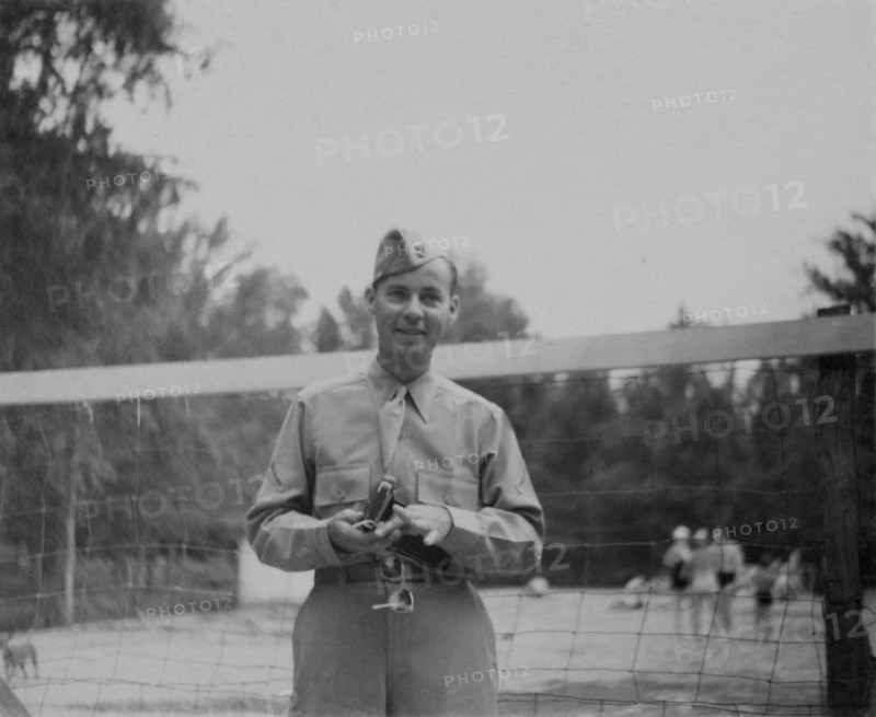 Soldier in Uniform in Front of Volleyball Net, Portrait, WWII, HQ 2nd Battalion, 389th Infantry, US Army Military Base, Indiana, USA, 1942