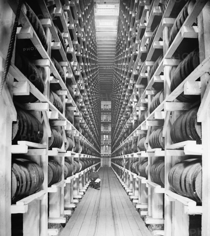 Worker Sitting in Rack Warehouse, Hiram Walker & Sons, Walkerville, Ontario, Canada, Detroit Publishing Company, 1910