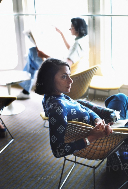 Profile of Mid-Adult Woman Sitting in Café on Cruise Ship, circa 1970's