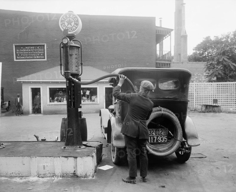 Man Putting Gas in Car at Gas Station, Washington DC, USA, Harris & Ewing, 1920