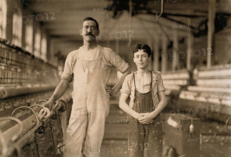 Portrait of Mule Spinner and Young Assistant at Cotton Mill, Burlington, Vermont, USA, Lewis Hine, 1909