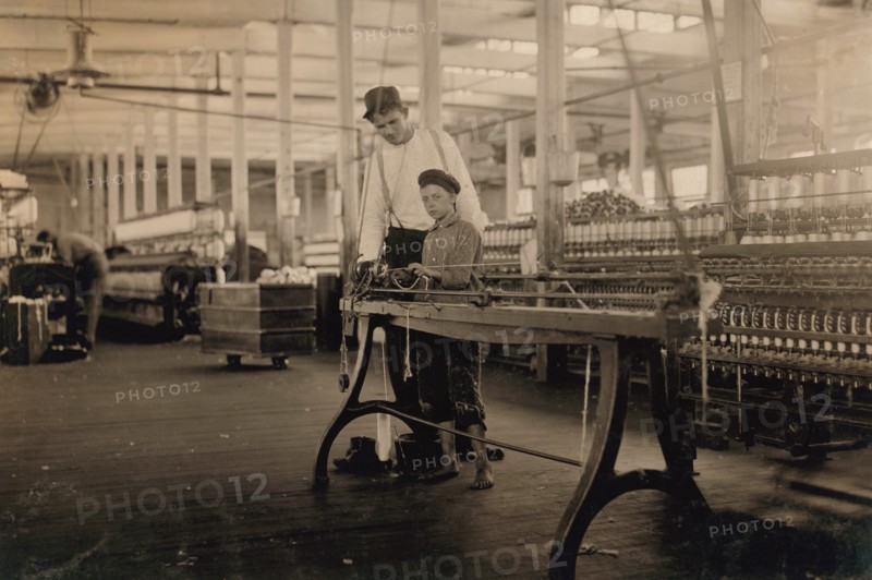 Young "Band-Boy" and Overseer, Yarn Mill, Yazoo City, Mississippi, USA, Lewis Hine, 1911