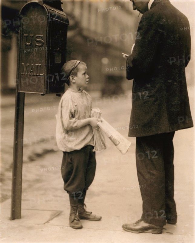 7-year-old Newsboy Selling Newspaper to Man, Works Every Day 2:30 to 8pm, 10am to Midnight on Saturday Earning 50 Cents per Day, Philadelphia, Pennsylvania, USA, Lewis Hine, 1910