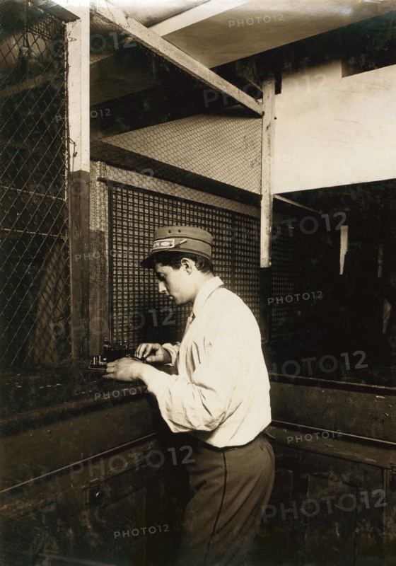 Postal Telegraph Boy Learning to Send Messages during Spare Moment, New York City, New York, USA, Lewis Hine, 1910