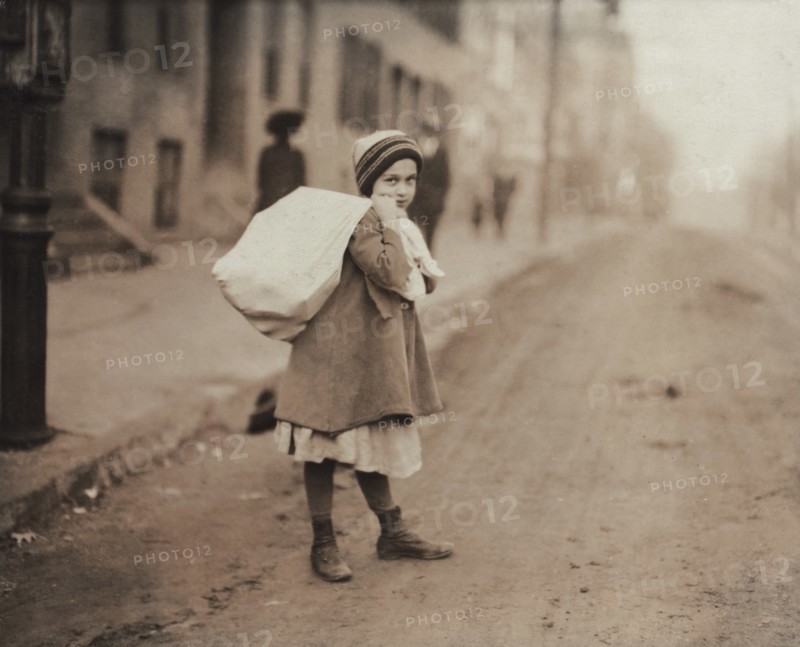 Young Girl Carrying Sack of Hosiery Supporters Home after Leaving Work and Before she Goes off to School, Worcester, Massachusetts, USA, Lewis Hine, 1912