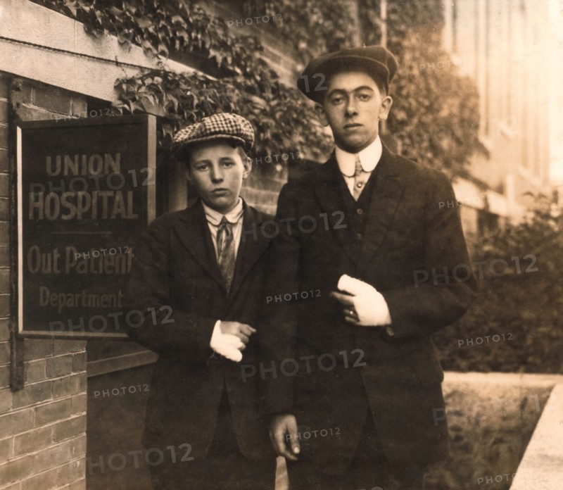 Portrait of Two 14-year-old Boys, Oscar Matoon and John Healy, with Hand Injuries Sustained while Working at Textile Mills, Fall River, Massachusetts, USA, Lewis Hine, 1916
