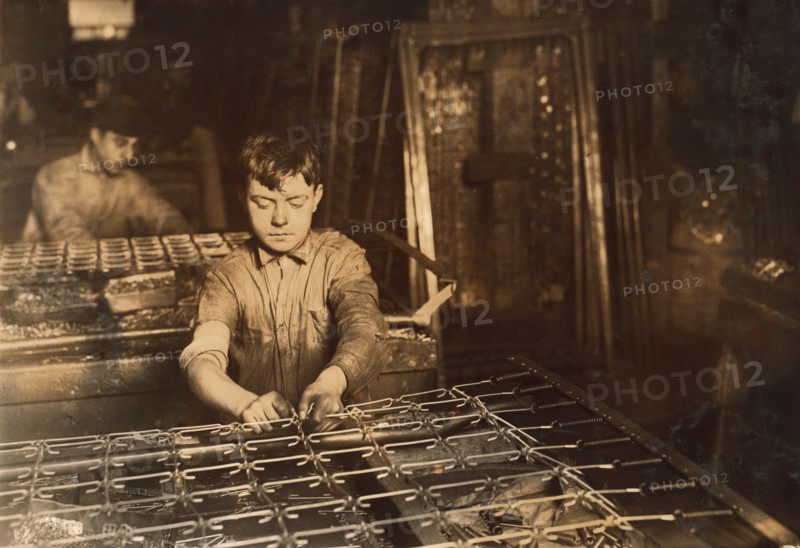 Young Boy Linking Bed Springs, Boston, Massachusetts, USA, Lewis Hine, 1917