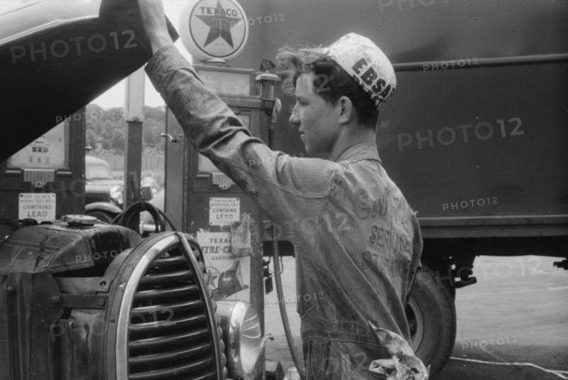 Attendant at Truck Service Station, U.S. 1, Washington DC, USA, Jack Delano for Farm Security Administration, circa 1940