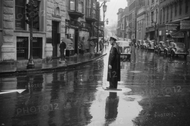 Traffic Cop on Rainy Day, Norwich, Connecticut, USA, Jack Delano for Farm Security Administration/Office of War Information, November 1940