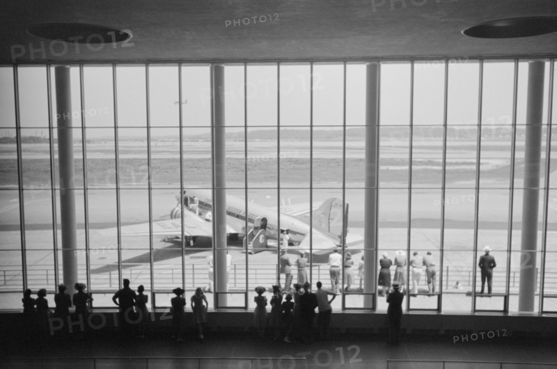 Visitors Watching Airplanes through Window of Main Waiting Room at Municipal Airport, Washington DC, USA, Jack Delano for Farm Security Administration, July 1941