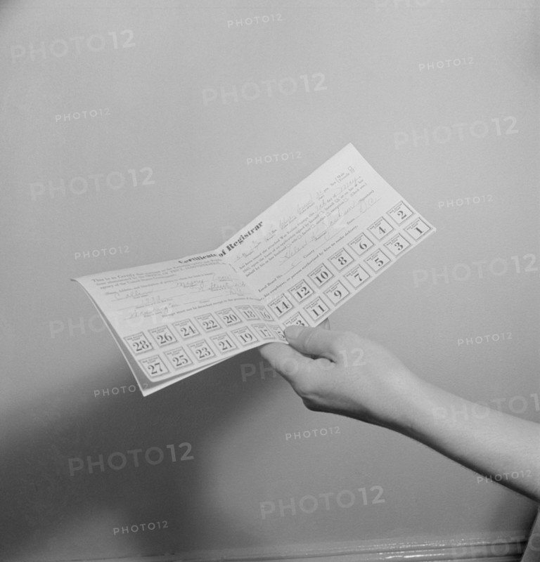 Hand Holding Sugar Rationing Card Showing Stamps during WWII, USA, Marjorie Collins for Office of War Information, May 1942