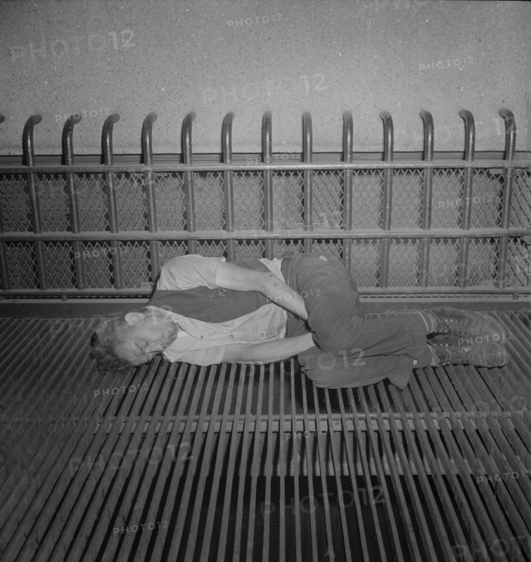 Bum Sleeping on Grate, the Bowery near 7th Street, New York City, New York, USA, Marjorie Collins for Office of War Information, September 1942