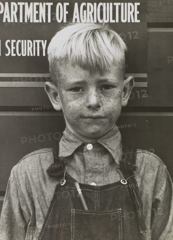Migrant Boy, Tulare Migrant Camp, Visalia, California, USA, Arthur Rothstein for Farm Security Administration (FSA), March 1940