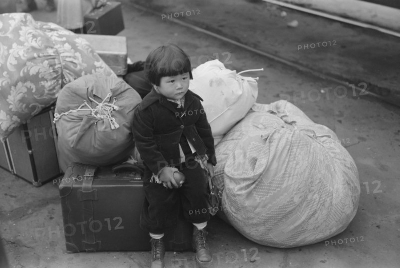Japanese-American Child During Evacuation of Japanese-Americans from West Coast Areas under U.S. Army War Emergency Order, Los Angeles, California, USA, Russell Lee, April 1942
