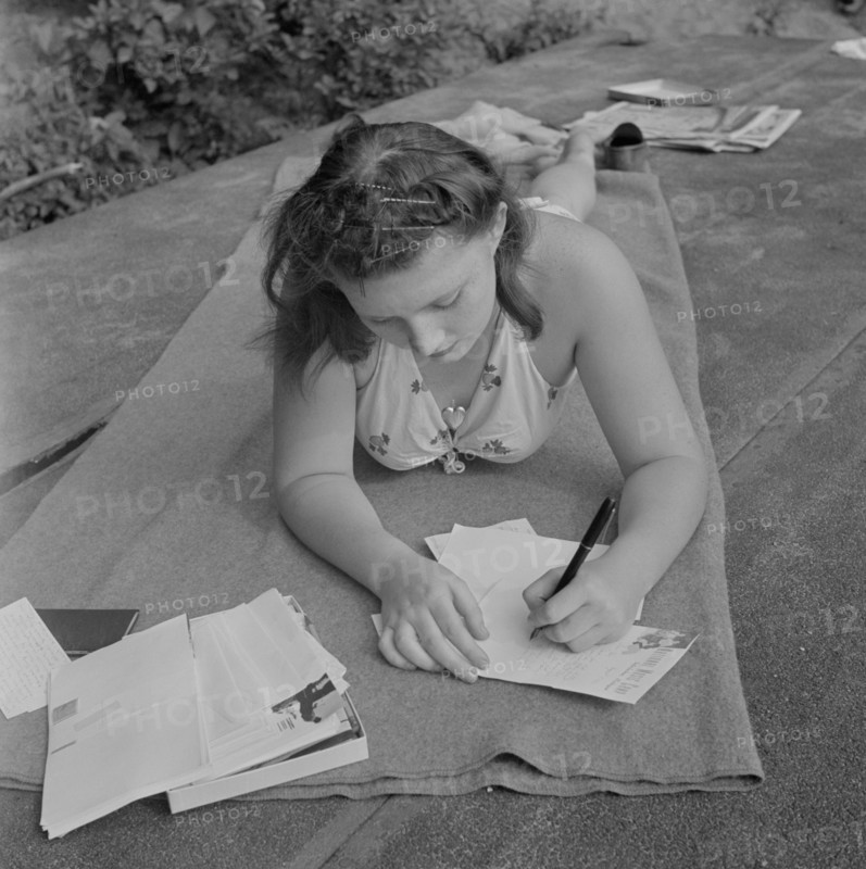 Young Girl Writing to Boyfriend Back Home while Away at Summer National Music Camp, Interlochen, Michigan, USA, Arthur S. Siegel for Office of War Information, August 1942