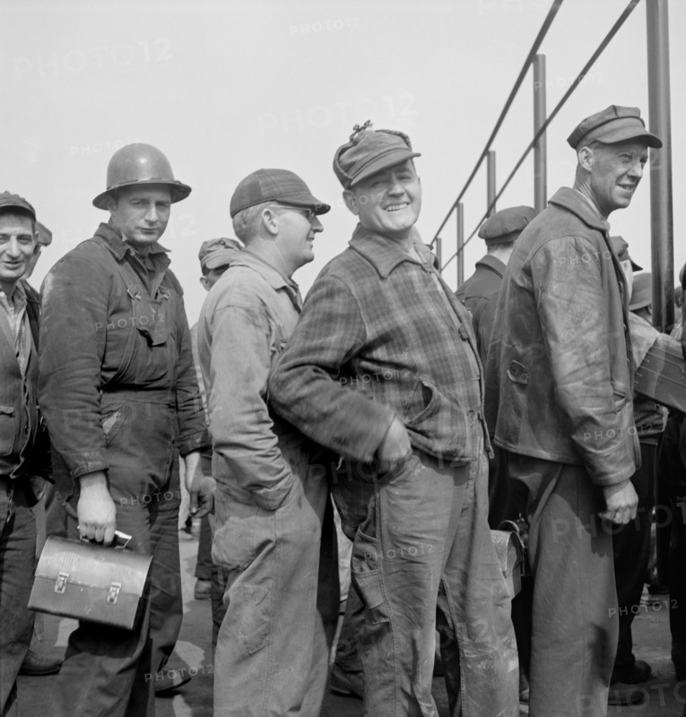 Workers Lining up Before Time Clock, Bethlehem-Fairfield, Shipyards, Baltimore, Maryland, USA, Arthur S. Siegel for Office of War Information, May 1943