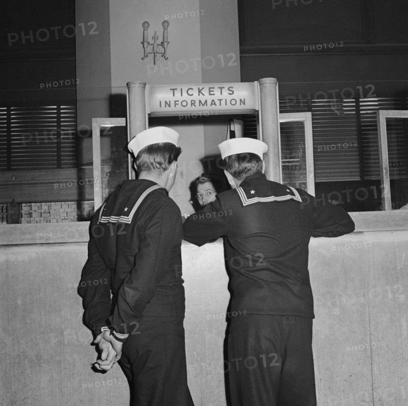 Two Sailors at Information Desk at Greyhound Bus Terminal, Chicago, Illinois, USA, Esther Bubley for Office of War Information, September 1943