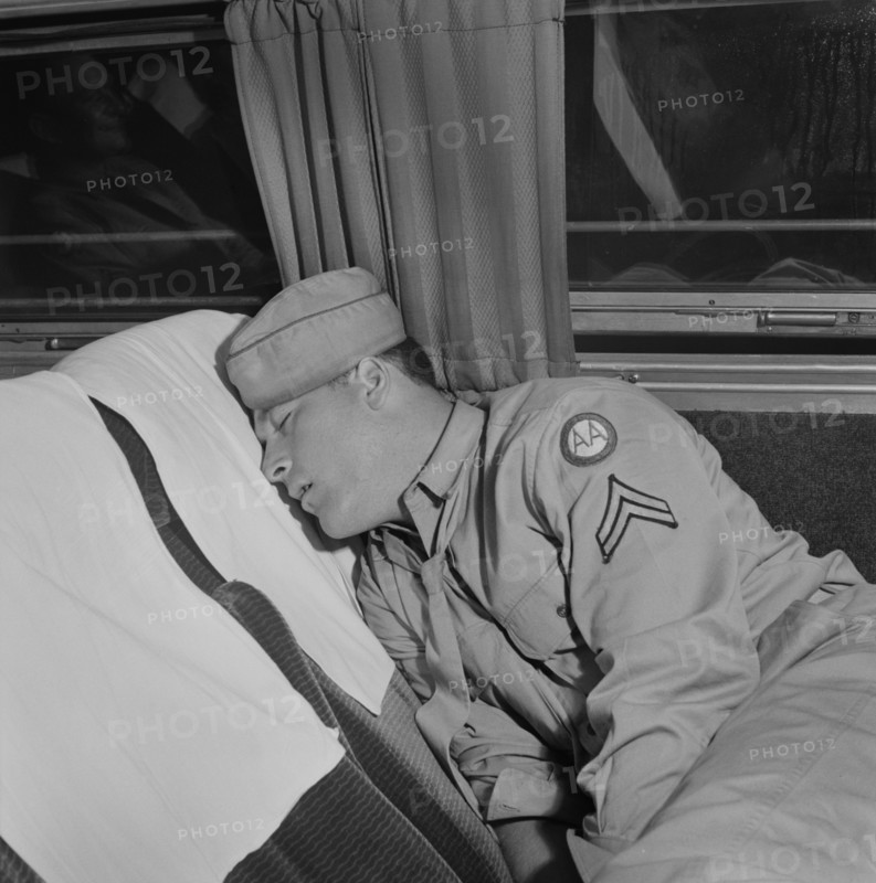 Soldier Sleeping on Greyhound Bus, Cincinnati, Ohio, USA, Esther Bubley for Office of War Information, September 1943