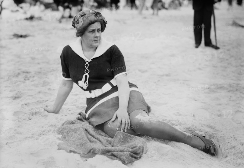 Woman Sitting on Beach, Long Beach, New York, USA, Bain News Service, circa 1910