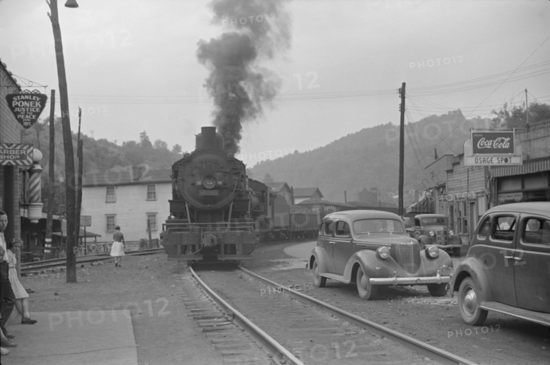 Train Pulling Through Center of Town, Osage, West Virginia, USA, Marion Post Wolcott for Farm Security Administration, September 1938