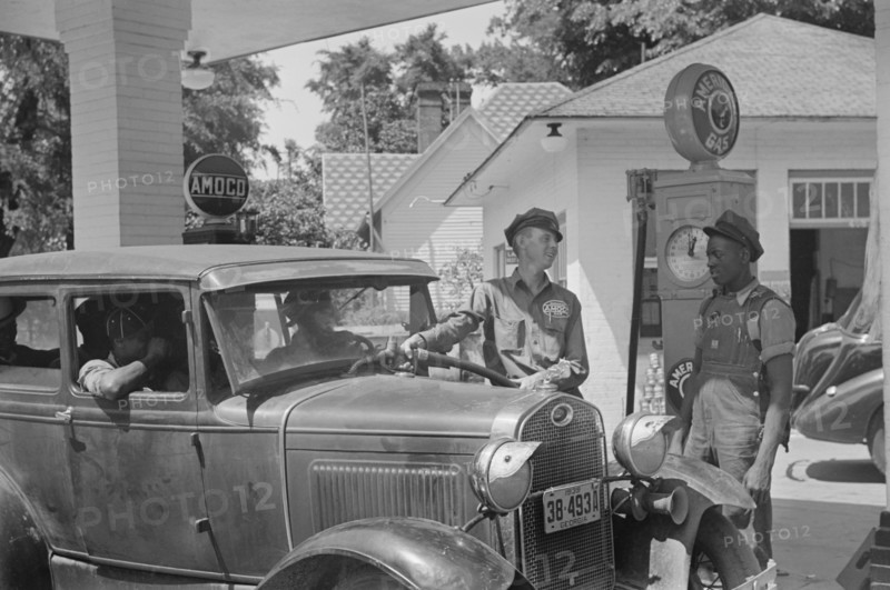 Gas Station Attendant Filling Car with Gasoline, Atlanta, Georgia, USA, Marion Post Wolcott for Farm Security Administration, June 1939