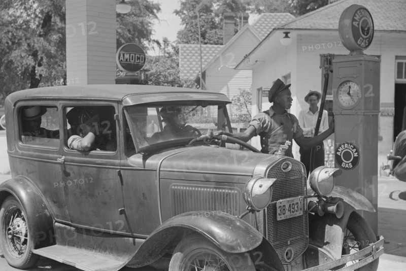 Gas Station Attendant Filling Car with Gasoline, Atlanta, Georgia, USA, Marion Post Wolcott for Farm Security Administration, June 1939