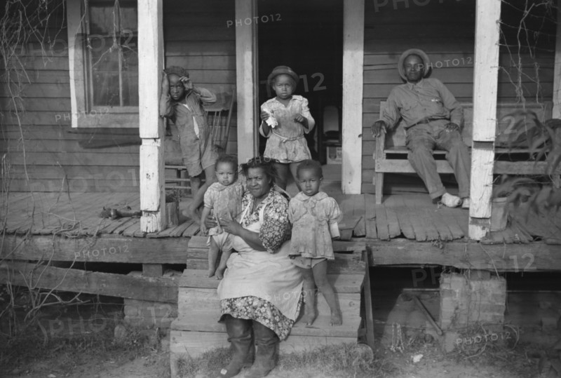 Tenant Farmer and Family on Porch, Marcella Plantation, Mileston, Mississippi, USA, Marion Post Wolcott for Farm Security Administration, October 1939