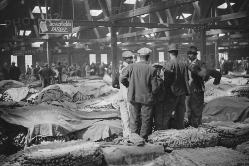 Farmers Waiting for Tobacco to be Sold at Auction in Warehouse, Durham, North Carolina, USA, Marion Post Wolcott for Farm Security Administration, November 1939