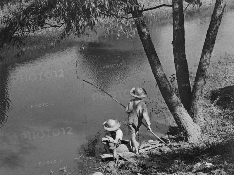 Two Cajun Boys Fishing in Bayou, Schriever, Terrabonne Parish, Louisiana, USA, Marion Post Wolcott for Farm Security Administration, June 1940