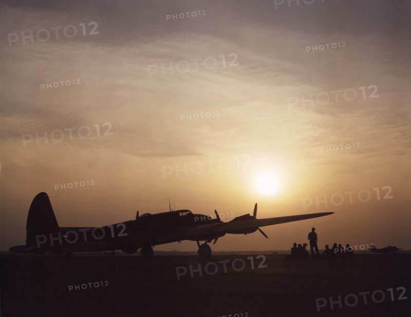Silhouette of B-17 Bomber "Flying Fortress" at Sunset, Langley Field, Virginia, USA, Alfred T. Palmer for Office of War Information, July 1942