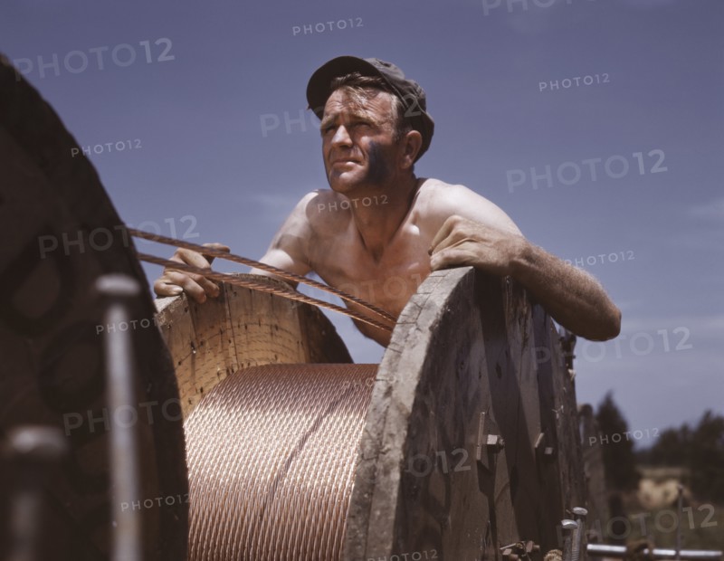 Construction Worker Performing Important War Service by Helping to Build Electric Power Line from Hydroelectric Plant in Louisville to Fort Knox to Supplement Existing Power Supply, Kentucky, USA, Alfred T. Palmer for Office of War Information, June 1942