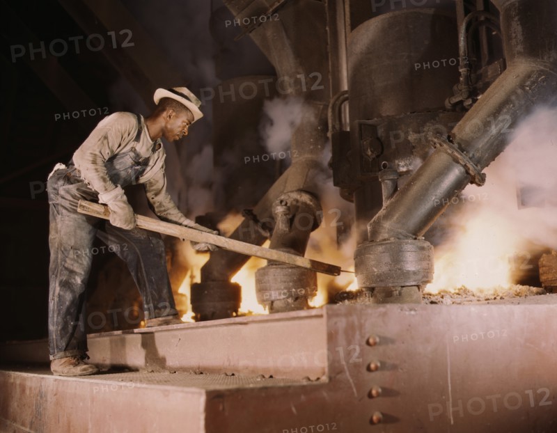 Man Working at Electric Phosphate Smelting Furnace in TVA Chemical Plant, near Muscle Shoals, Alabama, USA, Alfred T. Palmer for Office of War Information, November 1942