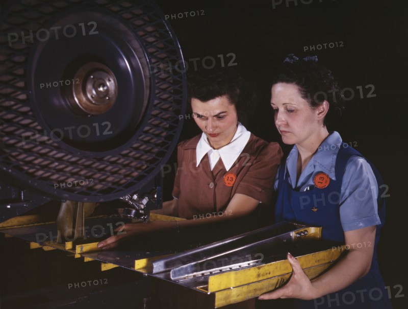 Two Female Workers Punching Holes in Frame Member for B-25 Bomber, North American Aviation, Inc, Inglewood, California, USA, Alfred T. Palmer for Office of War Information, June 1942