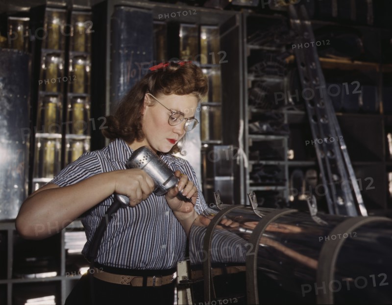Female Worker Operating Hand Drill, North American Aviation, Inc, Inglewood, California, USA, Alfred T. Palmer for Office of War Information, October 1942
