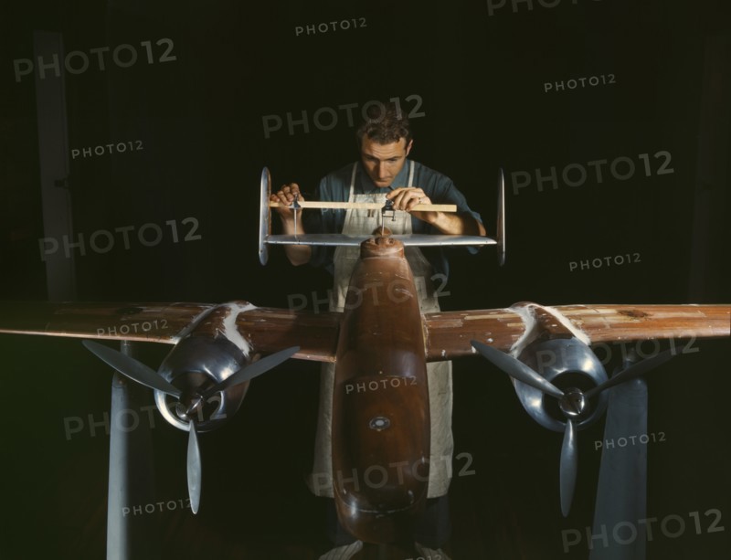 Worker Preparing Experimental Scale Model of B-25 Airplane for Wind Tunnel Tests, North American Aviation Plant, Inglewood, California, USA, Alfred T. Palmer for Office of War Information, October 1942