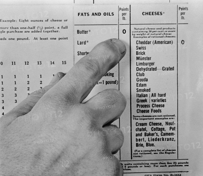 Finger Pointing to Chart of Point Values for Rationed Food Items during WWII, USA, Alfred T. Palmer for Office of War Information, March 1943