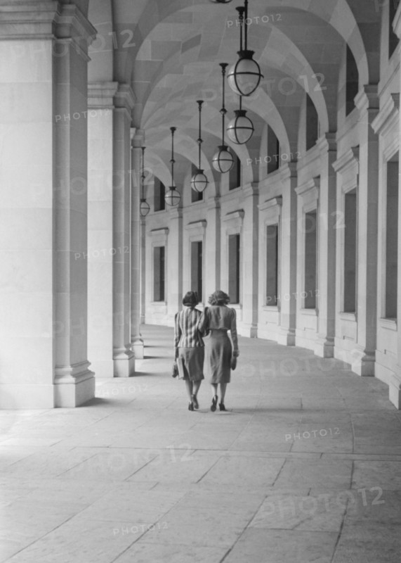 Rear View of Two Women Walking on Curved Walk Leading from Benjamin Franklin Post Office, 12th Street near Pennsylvania Avenue, Washington DC, USA, David Myers for Office of War Information, July 1939