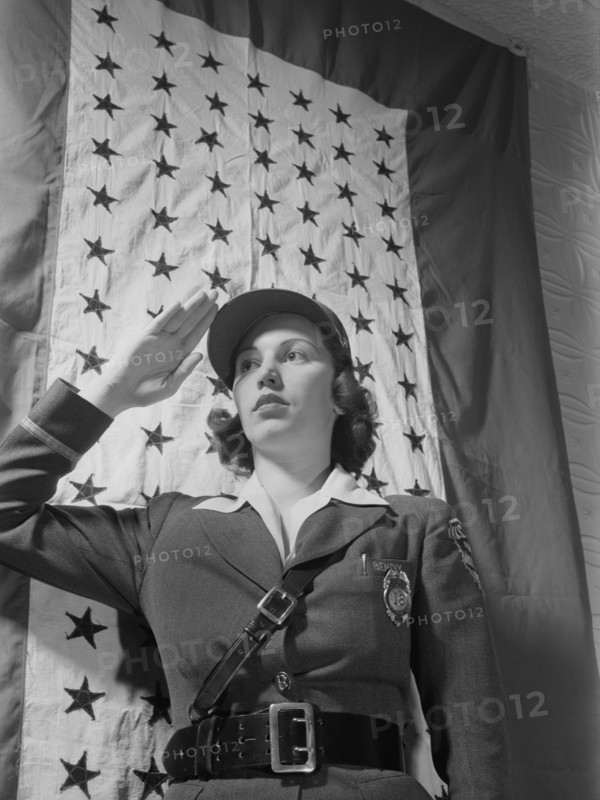 Female Guard Saluting Before Company Service Flag during World War II, Bendix Aviation Plant, Brooklyn, New York, USA, Ann Rosener for Office of War Information, March 1943