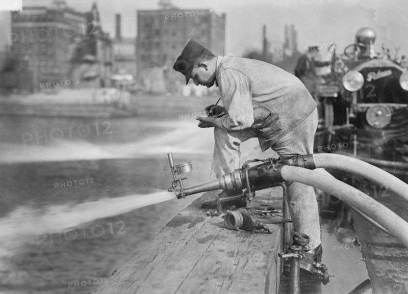 Fireman Testing Fire Engine, New York City, New York, USA, Bain News Service, September 1913