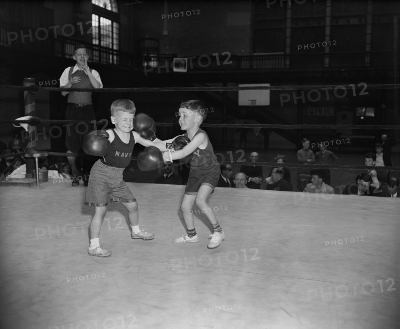 Wesley Hogan and Donald Fravel, both 6 years old, during Boxing Match, Navy Junior Boxing Championships for Sons of Naval Officers, Annapolis, Maryland, USA, Harris & Ewing, April 1939