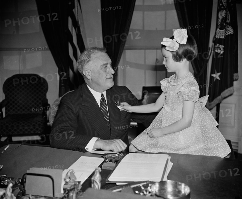 U.S. President Franklin Roosevelt being Presented with First Buddy Poppy of Annual National Poppy Sale by 6-year-old Jane Colgan, with Sales Devoted to Welfare and Relief Work for Veterans and their Families, White House, Washington DC, USA, Harris & Ewing, April 14, 1938