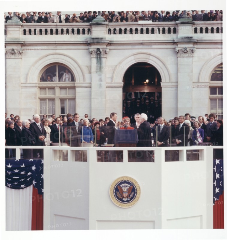 Chief Justice Warren E. Burger administering the oath of office to Ronald Reagan on the east portico of the U.S. Capitol, Washington DC, USA, Architect of the Capitol, January 20, 1981