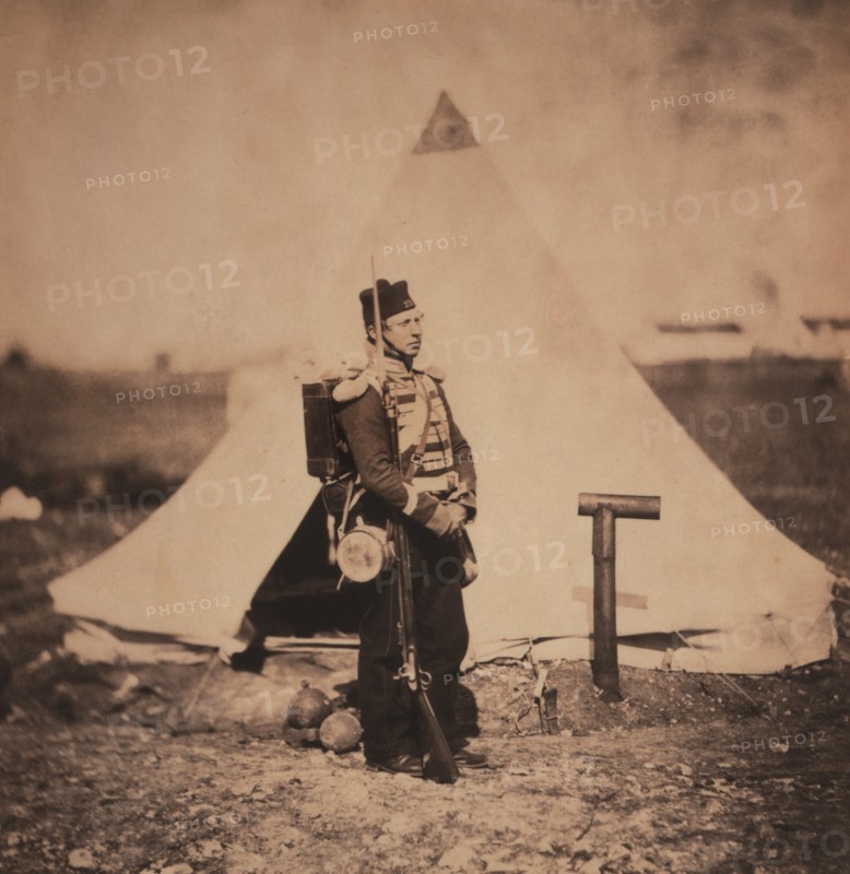 British Soldier, Full-Length Portrait in Full Marching Order with Military Tent in Background, Crimean War, Crimea, Ukraine, by Roger Fenton, 1855