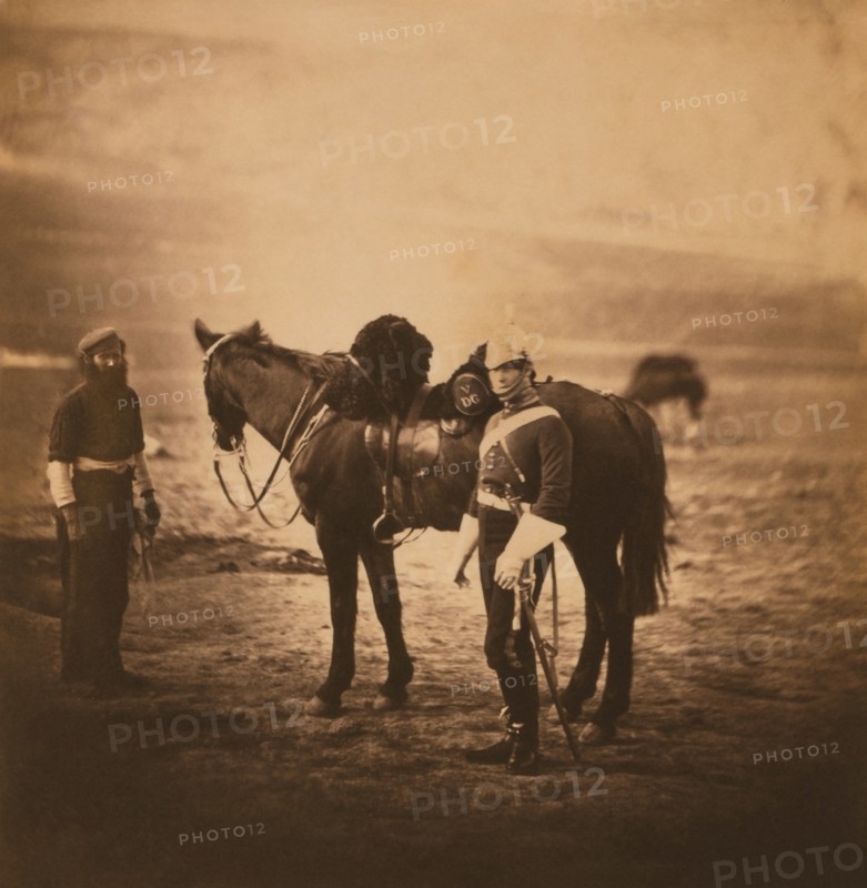 British Lieutenant Temple Godman, 5th Dragoon Guards, Full-Length Portrait Standing with Horse and Servant, Crimean War, Crimea, Ukraine, by Roger Fenton, 1855