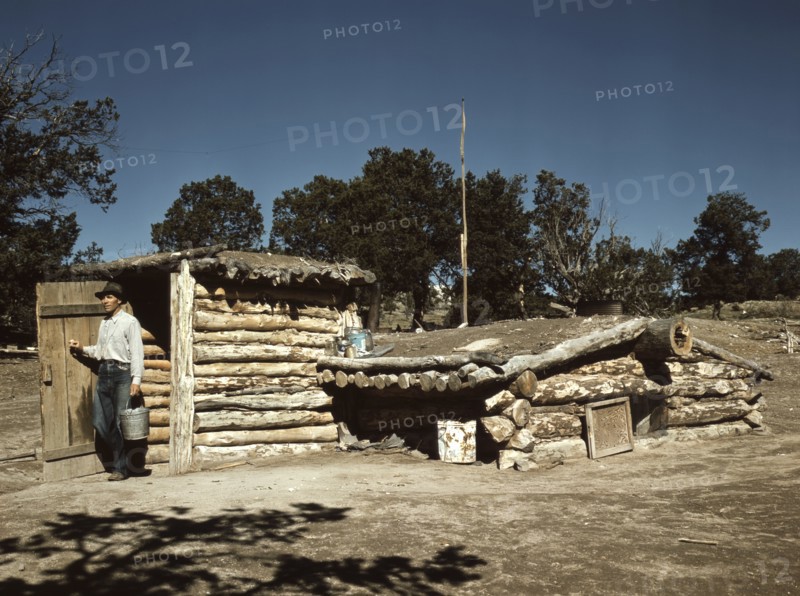Mr. Leatherman, Homesteader, Coming out of his Dugout Home, Pie Town, New Mexico, USA, Russell Lee for Farm Security Administration - Office of War Information, September 1940