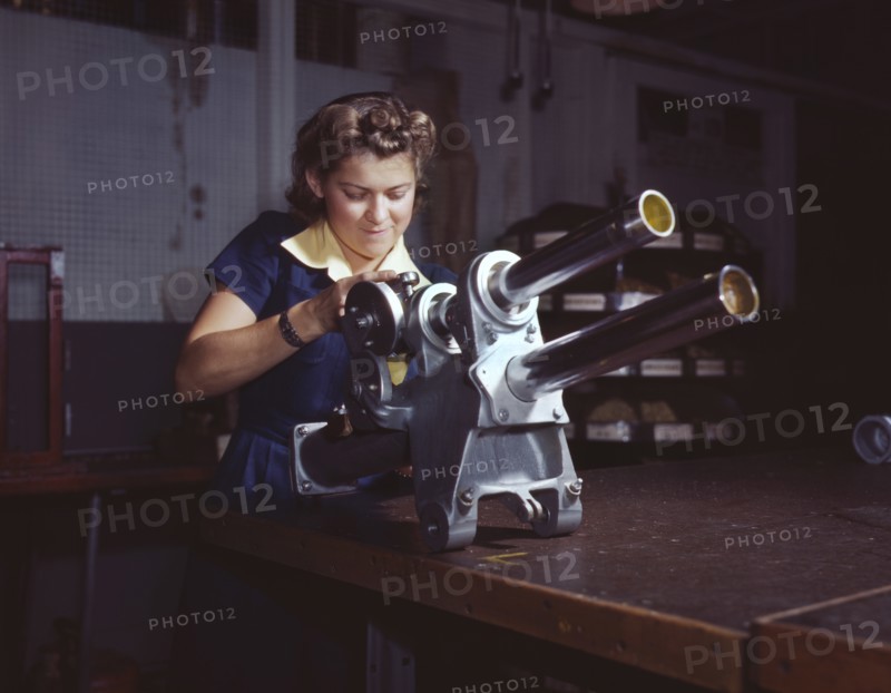 Young Woman Working on Landing Gear Mechanism of P-51 Fighter Plane, North American Aviation, Inc., Inglewood, California, USA, Alfred T. Palmer for Office of War Information, October 1942