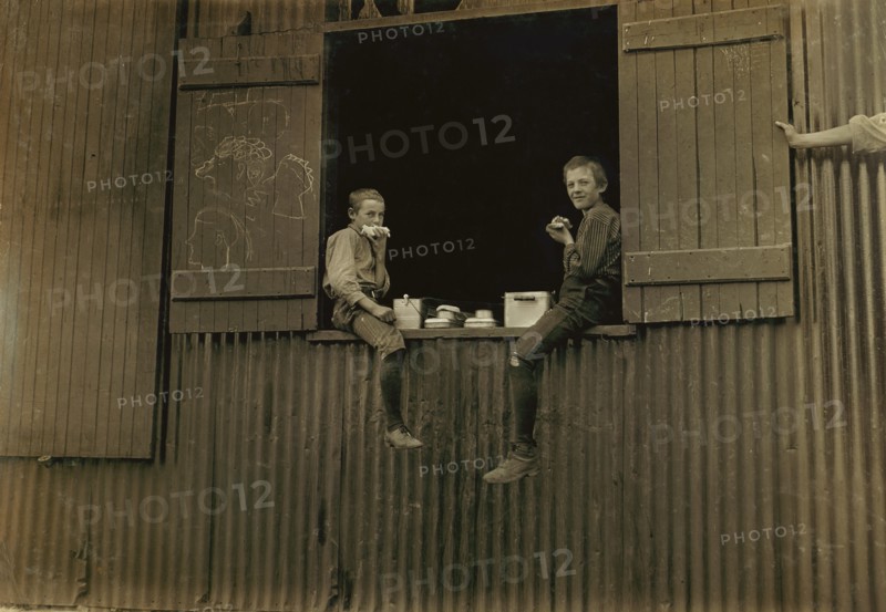 Two Young Boys eating Lunch, Economy Glass Works, Morgantown, West Virginia, USA, Lewis Hine for National Child Labor Committee, October 1908