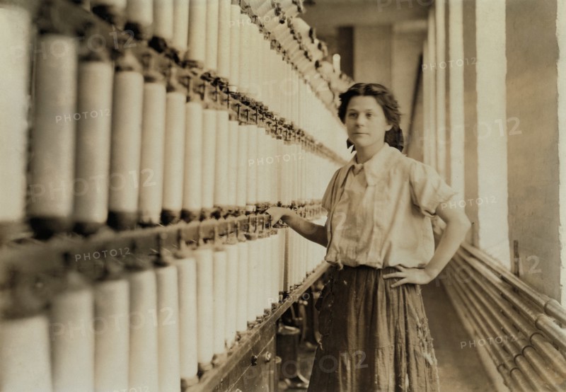Anna Grenier, at her "Speeder", Chace Cotton Mill, Burlington, Vermont, USA, Lewis Hine for National Child Labor Committee, May 1909