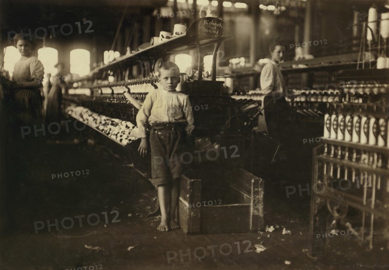 Young Eight-Year-Old Boy, 48 inches high, Picks up Bobbins at 15 cents per day, Elk Cotton Mills, Fayetteville, Tennessee, USA, Lewis Hine for National Child Labor Committee, November 1910