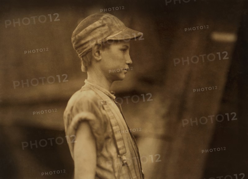 Young Doffer, Half-Length Profile, Avondale Mills, Birmingham, Alabama, USA, Lewis Hine for National Child Labor Committee, November 1910